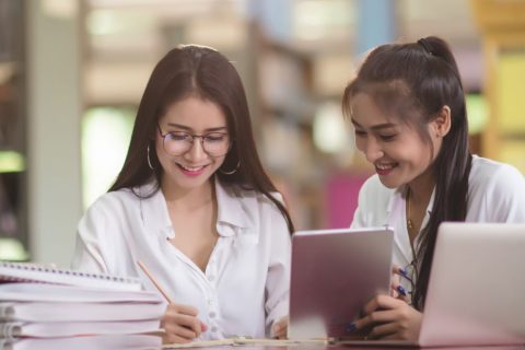 young-students-learning-library-bookshelvesrere